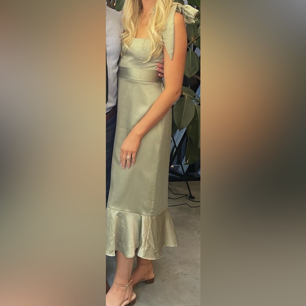 Sage green Show Me Your Mumu bridesmaids dress.